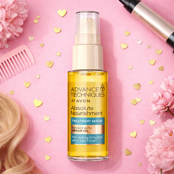 Avon Advance Techniques Absolute Nourishment Treatment Serum argan oil hair serum on pink background with flowers