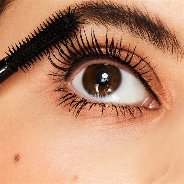 Applying Avon Lash Genius mascara for fuller longer lifted lashes close up