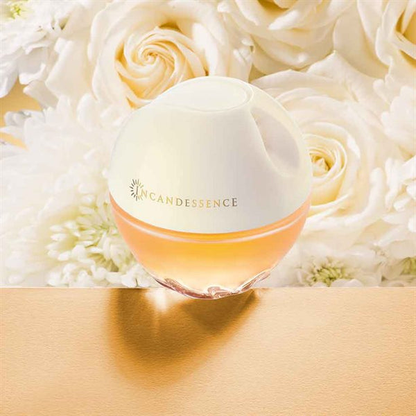 Avon Incandessence perfume bottle with rose floral background women's fragrance